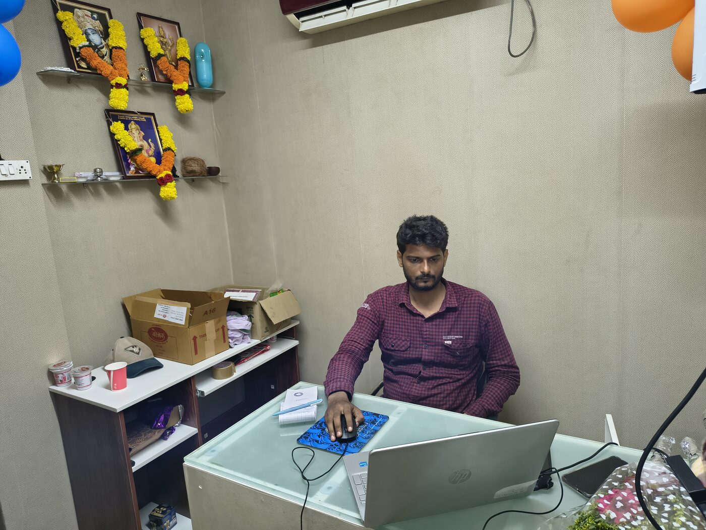 Dattatray Karkare, founder of Sarvoday Solar Solutions, at his desk in the company's Ratnagiri office